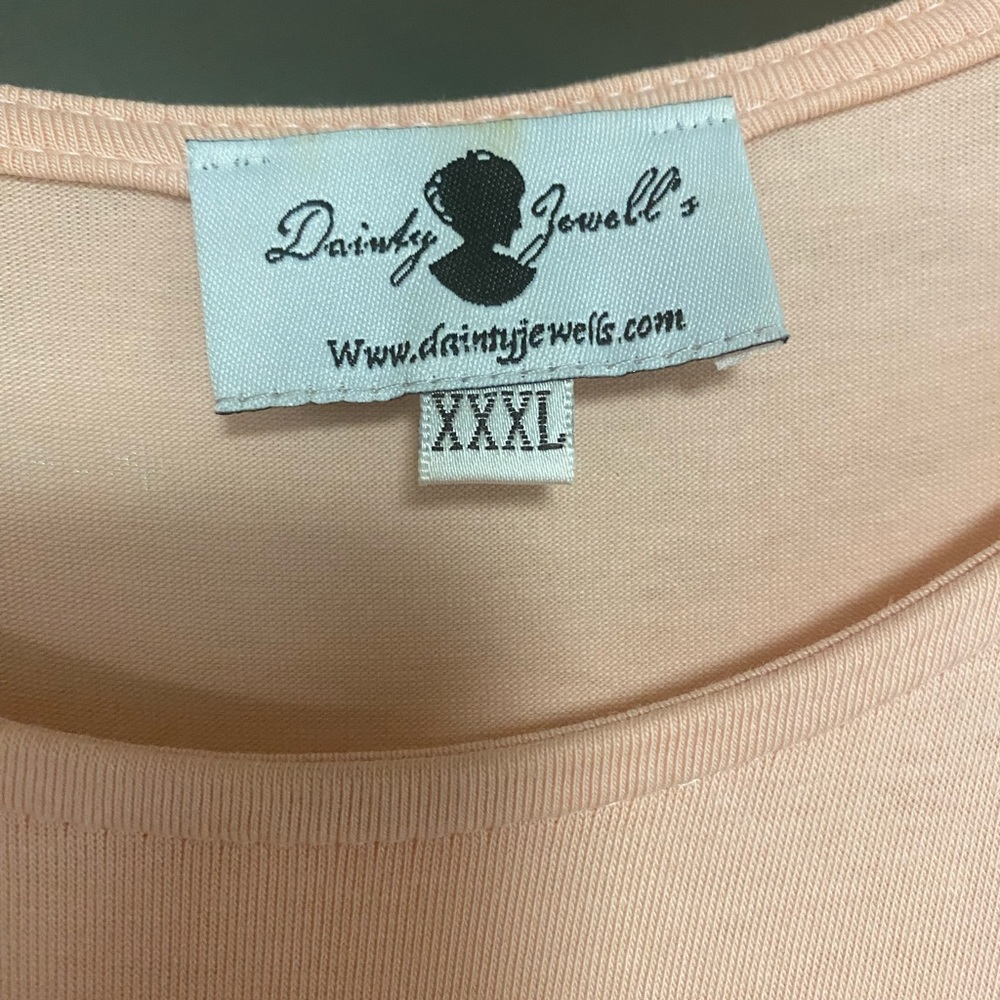 It is a Dainty Jewells dress. It’s only been worn once it is a 3X